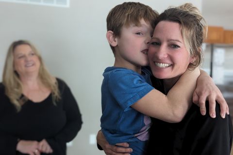 Kelsey Warshefski holding her son