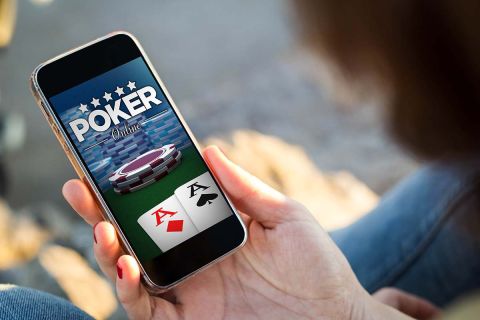 someone playing poker online on phone