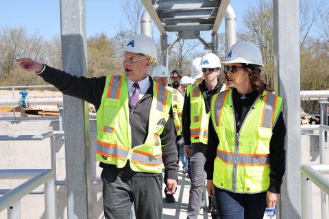 Gov. Gretchen Whitmer in a hard hat and gree 