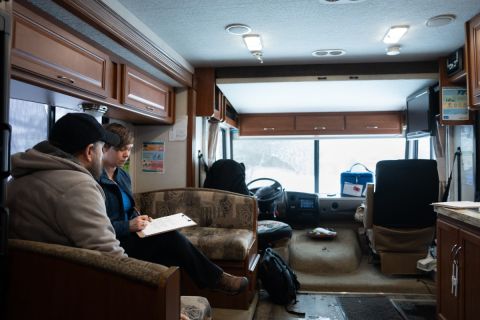 people sitting in a RV