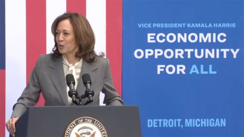 Vice President Kamala Harris speaking into the microphone