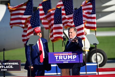 Mike Rogers on the stage with Donald Trump
