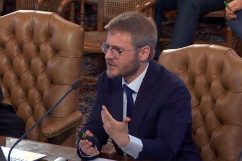 Gabriel Ehrlich sitting at a table. 