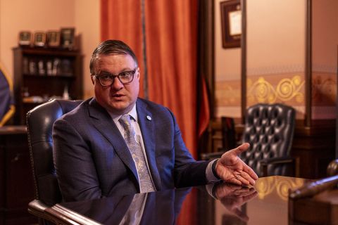 Michigan House Speaker Matt Hall sits at a table.