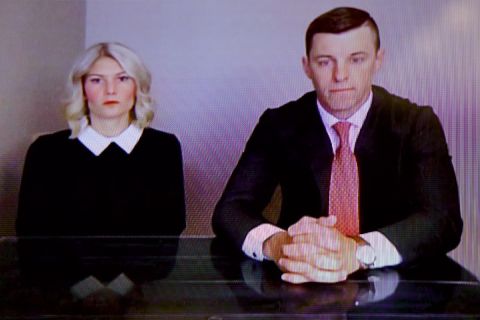 Stephanie Chatfield sits to the left of Lee Chatfield at a desk