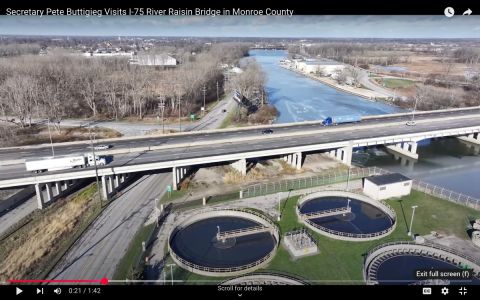 A screen grab of a YouTube video showing a bridge over a river