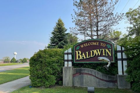 A sign welcomes travelers to Baldwin