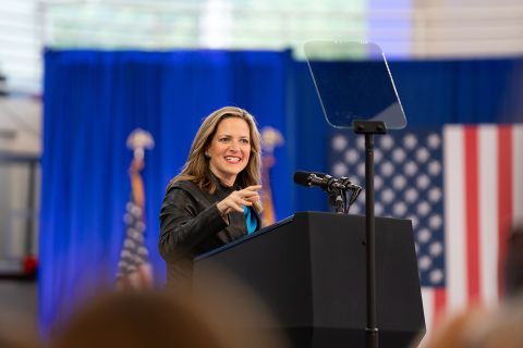  Secretary of State Jocelyn Benson speaking to a crowd. 
