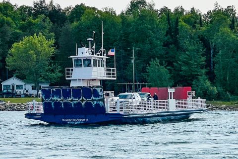 A white and blue ferry. 