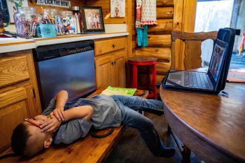 Langell boy reclining on the floor