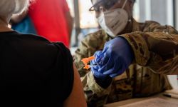 Staff Sgt. Ayanna McFaddin of the National Guard gives the Pfizer Biotech Covid-19 Vaccination on March 3 at the Holland Civic Center Place. A new CDC study underscores the effectiveness of the two-dose COVID vaccines once recipients are fully vaccinated. 