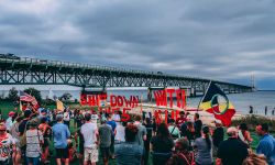 Demonstrators gather in Mackinaw City for a protest against the Line 5 pipeline