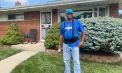 Bernard Cox poses in front of his Eastpointe home