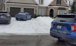 house with MSP police cars nearby