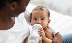 baby drinking out of bottle