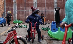 kid riding a scooter 