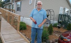 man in front of mobile home