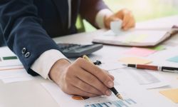 man with charts on table