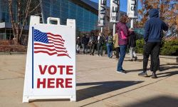 people standing in line to vote