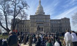 Several hundreds of MSU students protest at the Capitol on a sunny day