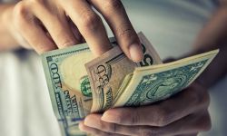 someone holding cash