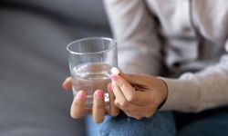 woman about to take pill 