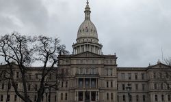 outside the Michigan capitol building on a cloudy day