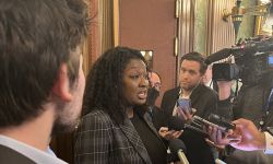 State Sen. Sarah Anthony surrounded by reporters 