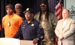 Detroit Police Chief James White surrounded by people at a press conference