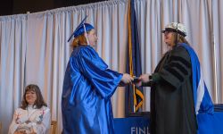 a student getting diploma on stage