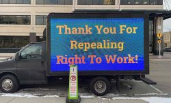 mobile billboard truck with a sign that says "Thank You for Repealing Right-to-Work