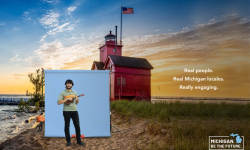 man playing ukulele on lake