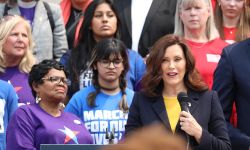 Gov. Gretchen Whitmer speaking into a microphone