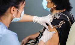 older woman getting a vaccine 