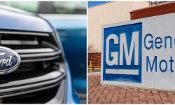 ford car on the left, gm sign on the right
