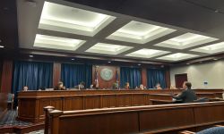 People sitting in committee room