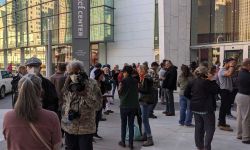 people standing outside the TCF Center in Detroit after the 2020 election