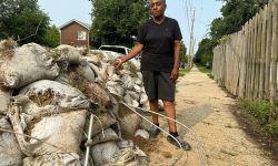 someone standing to sandbags in Detroit