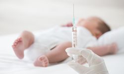 Syringe with blur baby background