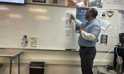 teacher looking at a whiteboard
