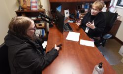 two people talking to each other across a table