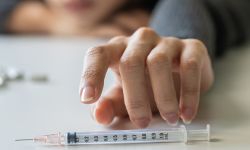 girl hand reaching for syringe,