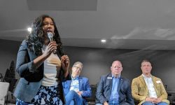 Michigan GOP Chair Kristina Karamo speaking into a microphone