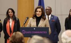 Gov. Gretchen Whitmer speaking into a microphone