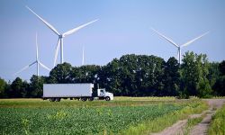 truck in front of windmills