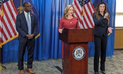 Secretary of State Jocelyn Benson speaking at a podium