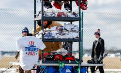 Man selling Trump 2024 shirts