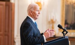 President Joe Biden stands at a podium