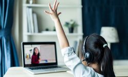 little young girl student learning virtual internet online class from school teacher by remote meeting