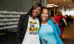 Charity Dean with member Trecia Johnson posing for photo